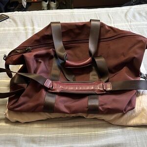 Tumi Maroon Duffel Bag with Brown Accents